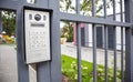 Video intercom on the gate at the entrance to the residential area. Electronic intercom to a private area. closed residential yard Royalty Free Stock Photo