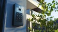 Video intercom system with built-in camera outdoor setting high-tech device residential area close-up view security concept