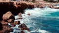 Video of lazur sea waves hitting the big stones