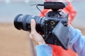 Video Making with the stabilizer. Man recording a video with a slr camcoder. Royalty Free Stock Photo