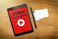 Video Marketing on mobile device screen with pen and business ca Royalty Free Stock Photo