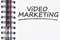 Video marketing words on spring note book Royalty Free Stock Photo