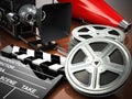 Video, movie, cinema vintage concept. Retro camera, reels and cl Royalty Free Stock Photo