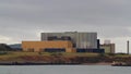 Video, Nuclear power station seen from across bay zoomed in.