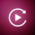Video play button like simple replay icon isolated on purple background