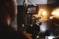 Video production backstage. Behind the scenes of creating video content, a professional team of cameramen with a