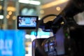 video production camera recording live event on stage. television social media broadcasting seminar conference Royalty Free Stock Photo