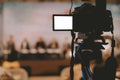 Video production camera recording live event on stage. television social media broadcasting seminar conference Royalty Free Stock Photo