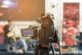 Video production covering event on stage by professional video camera in outdoor concert Royalty Free Stock Photo