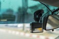 video recorder next to a rear view mirror, CCTV car camera for safety on the road accident Royalty Free Stock Photo