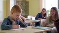 Video of sad boy sitting mocked in class.