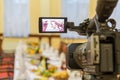 Video shooting at a restaurant at a Banquet. Camcorder with LCD display Royalty Free Stock Photo