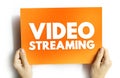 Video Streaming is a method of viewing video content without actually downloading the media files, text concept on card Royalty Free Stock Photo