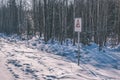 video surveilance camera warning sign in winter forest - vintage