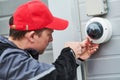 Video surveillance service. Technician installing camera