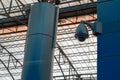 Video surveillance system at the station. Protected video camera mounted on support. Concept security in public places, antiterror