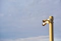 Video Surveillance. Video Camera on side post against a blue sky background. Security concept, forbidden territory, entry and Royalty Free Stock Photo