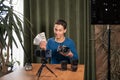 Video training for beginner photographers, online courses. A Muslim man holds a pack of one hundred dollar bills in his