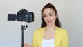 Videoblog, vlog, vloger, blog, blogging, Video, mass media and interview. Smiling young woman or bloger gestures with