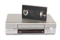 Videocassette and VCR on a white background