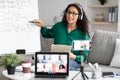 Young teacher showing board, giving virtual lecture to diverse students Royalty Free Stock Photo