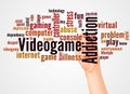 Videogame addiction word cloud and hand with marker concept