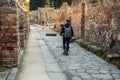 Videographer filming ruins of famous Pompeii city, Italy