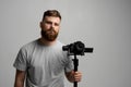 Videographer making a good footage using steadicam. Cameraman creator with a stabilizer in his hands takes a video on Royalty Free Stock Photo