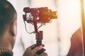 Videographer recording video with mirrorless digital camera on Gimbal Royalty Free Stock Photo