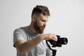 Videography, filmmaking and creativity concept. Portrait of videographer with a camera and gimbal. Professional video Royalty Free Stock Photo