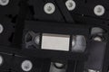 Videotape with blank tags. Pile of VHS video cassettes. Vintage media. Isolate on a white back Royalty Free Stock Photo