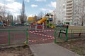 Children`s playground fenced with red-white tape during the quarantine COVID-201