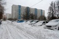 Cars in parking after night snowstorm in the yard in Vidnoe Royalty Free Stock Photo