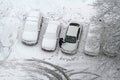 Man scraping snow and ice from car window in the yard in Vidnoe top view Royalty Free Stock Photo