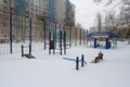 Sports playground under snow after night snowstorm in the yard in Vidnoe Royalty Free Stock Photo