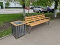 Street urn and bench fenced with red-white tape during the quarantine COVID-2019 in the courtyard of Vidnoe