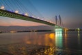 Vidyasagar bridge (setu) on river Ganges at twilight with city lights reflections. Royalty Free Stock Photo