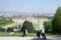 VIENNA, AUSTRIA - APR 30th, 2017: Classic view of famous Schonbrunn Palace with Great Parterre garden with people Royalty Free Stock Photo