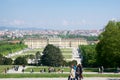 VIENNA, AUSTRIA - APR 30th, 2017: Classic view of famous Schonbrunn Palace with Great Parterre garden with people Royalty Free Stock Photo