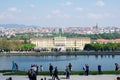 VIENNA, AUSTRIA - APR 30th, 2017: Classic view of famous Schonbrunn Palace with Great Parterre garden with people Royalty Free Stock Photo