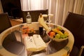 VIENNA, AUSTRIA - APR 28th, 2017: Romantic evening with bottle of red wine, sweets and fruits in the luxury hotel room