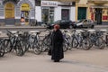 afternoon wander an old woman gracefully strolls down the street