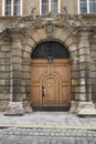 Vienna, Austria - 15 April 2018: ancient wooden doors. main entrance with family coat of arms.