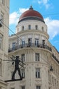 Vienna, Austria - 17 April 2012: Metal statue of the chimney sweeper on a street corner. Symbol of flue cleaner