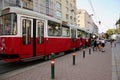 Vienna, Austria - August 22, 2018: many people passengers board a tram car, urban public transport