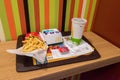 McDonald menu with McF1rst sandwich, french fries and Coca-Cola for drink
