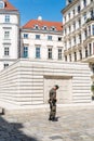 Soldier guarding Judenplatz Holocaust Memorial in historical cit