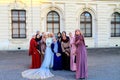 Vienna, Austria, Beautiful girls in Muslim clothes and wedding dress are photographed near the palace, Europe