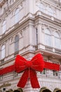 Building facade decorated with Christmas Red Bow on Popp and Kretschmer department store