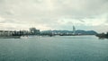 VIENNA, AUSTRIA - DECEMBER, 25 Danube river, touristic boats and distant Pensionsversicherungsanstalt office